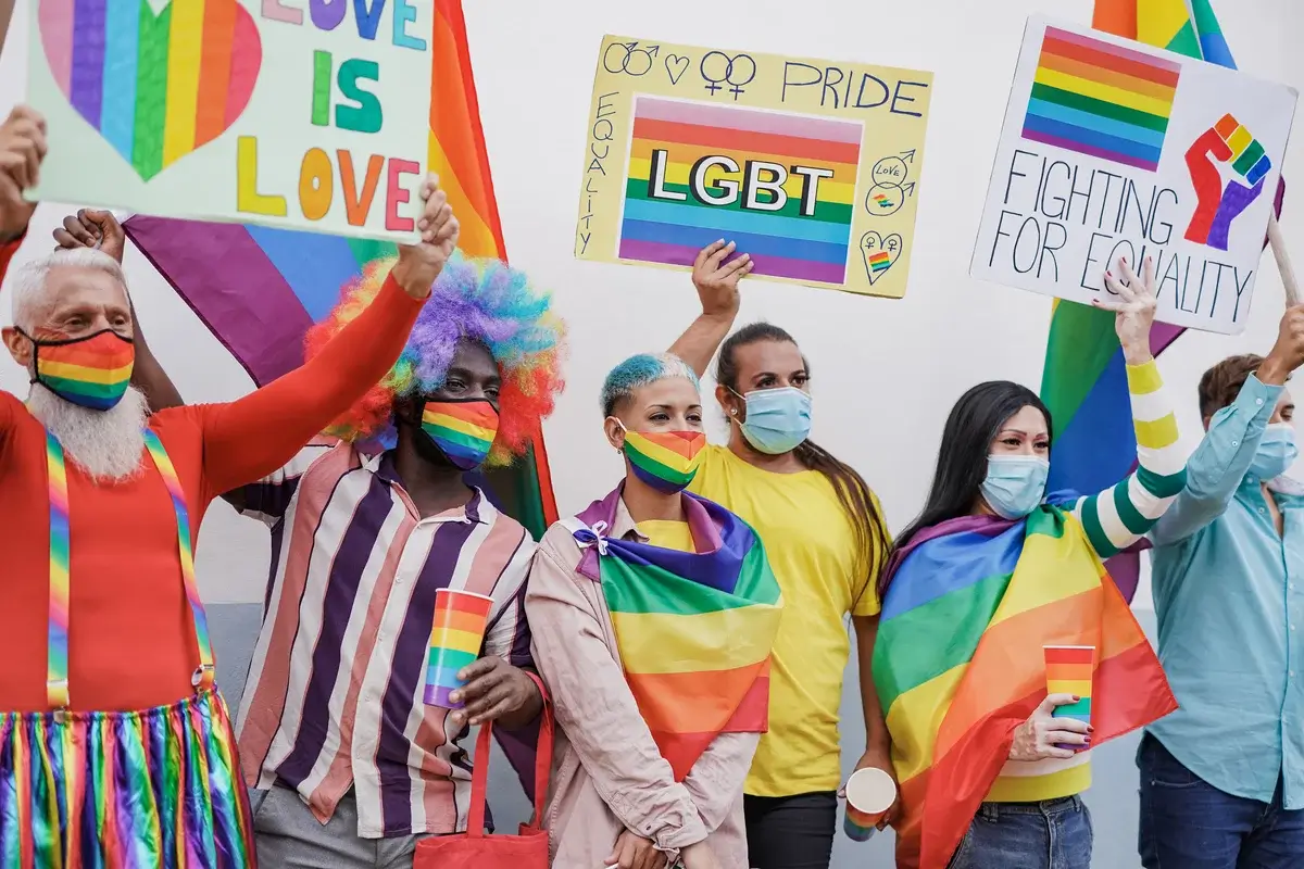 mulitracial-people-holding-banner-at-gay-pride