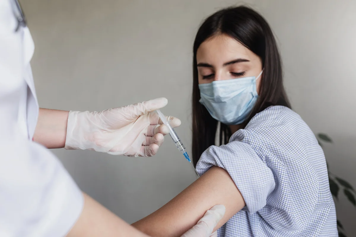 the-doctor-injects-the-vaccine-to-the-girl