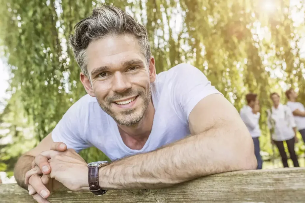 portrait-of-mid-adult-man-leaning