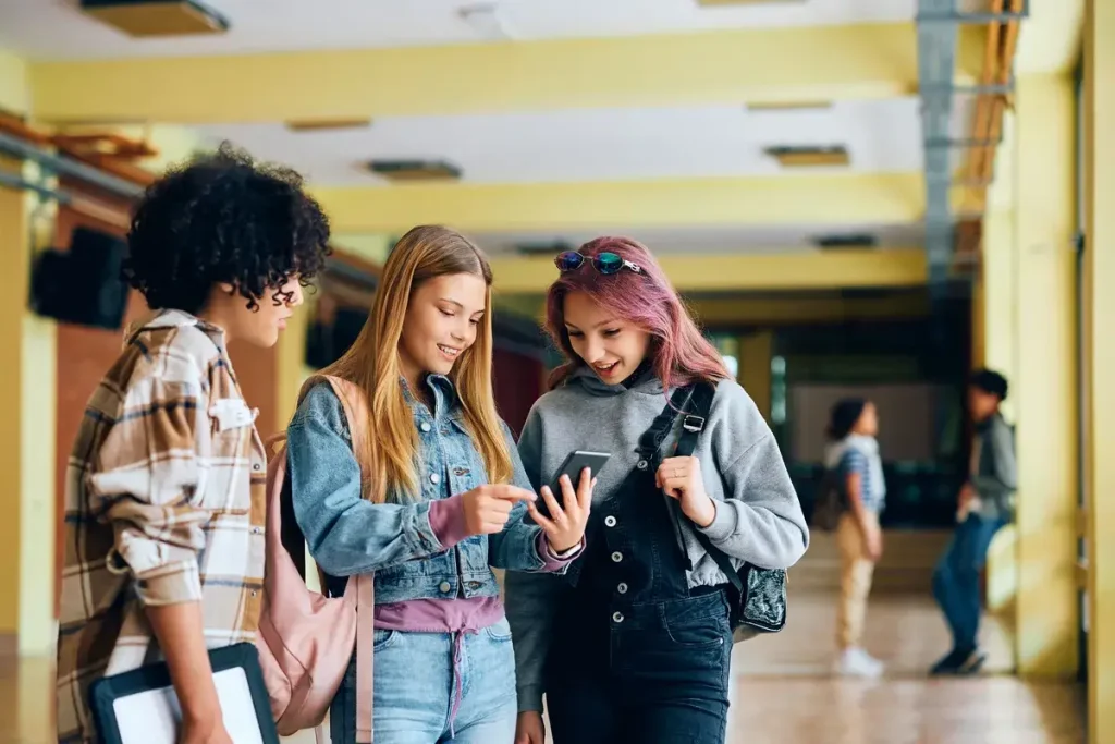 group-of-high-school-students-using-cell-phone