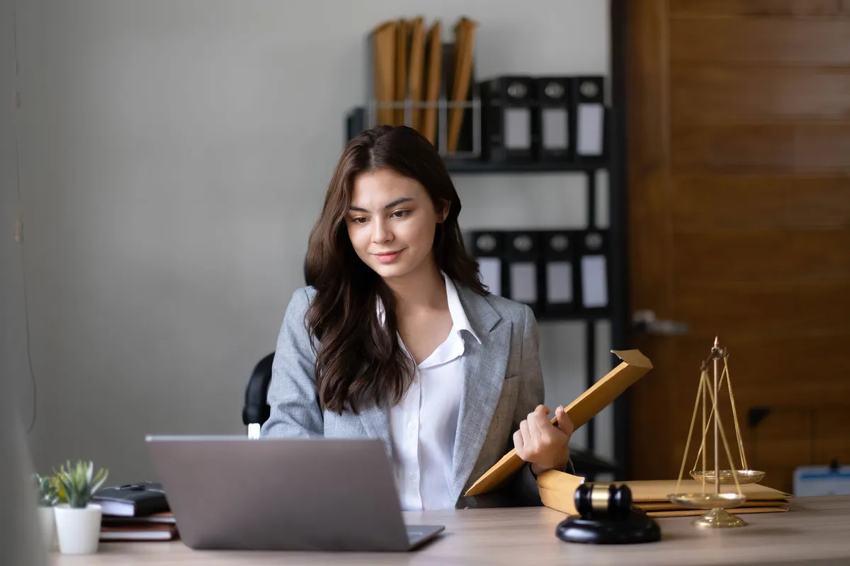 asian-lawyer-woman-working-with-a-laptop