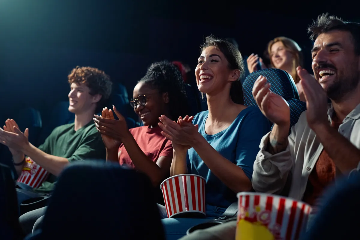 happy-spectators-applauding-after-movie-projection