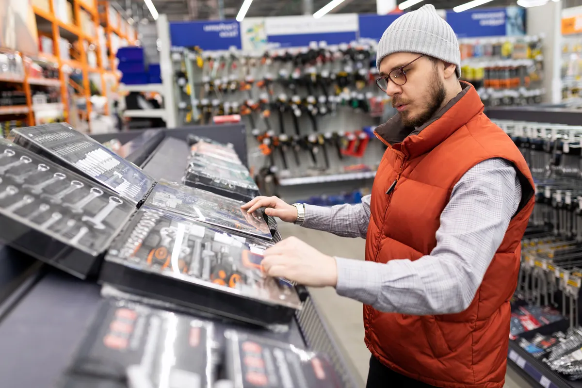 a-man-chooses-a-set-of-sockets-to-repair