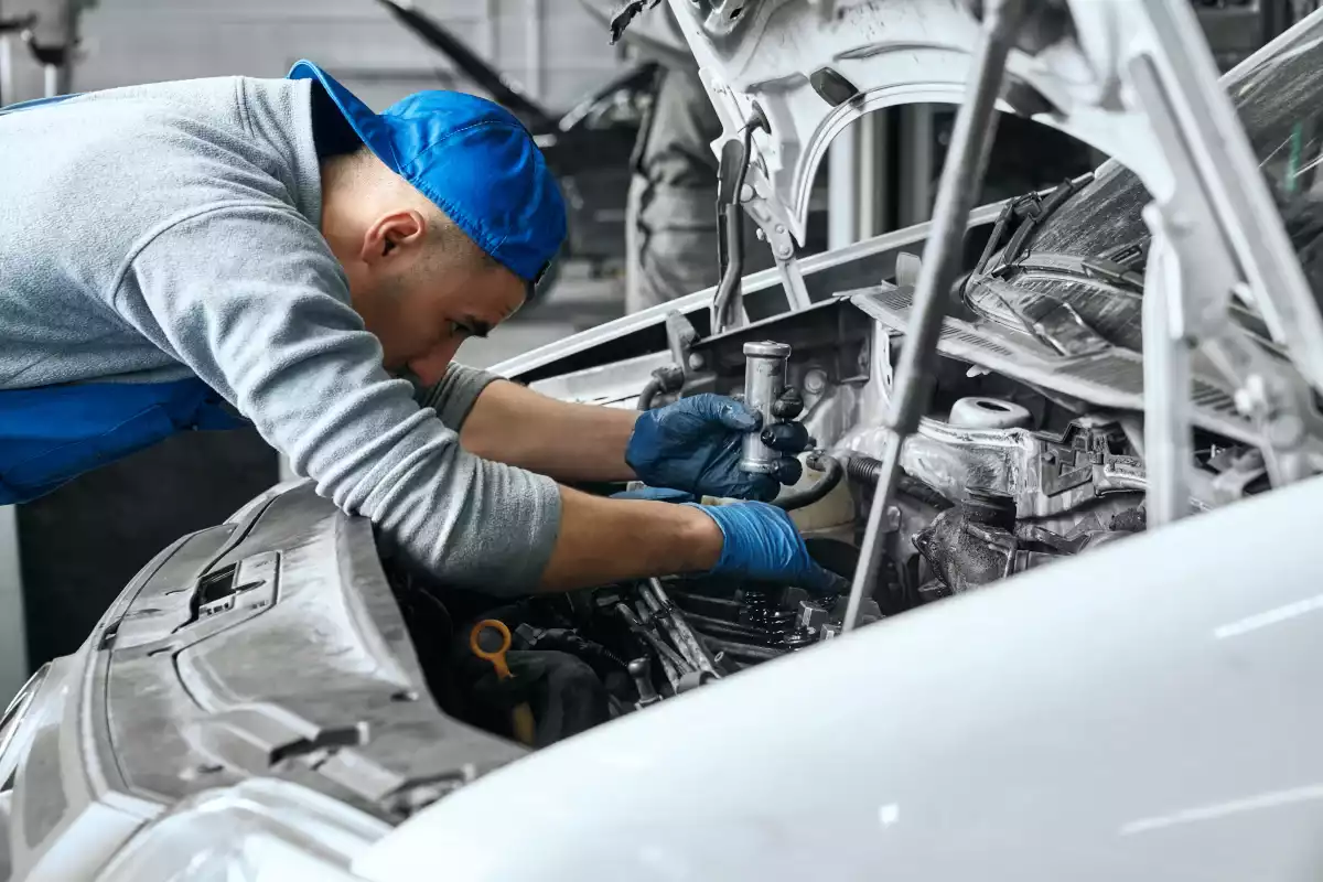 mechanic-in-blue-overalls-checking-serviceability