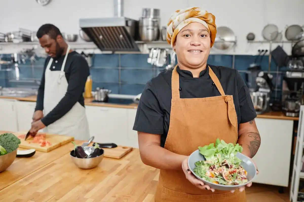 smiling-chef-in-cafe-kitchen.webp