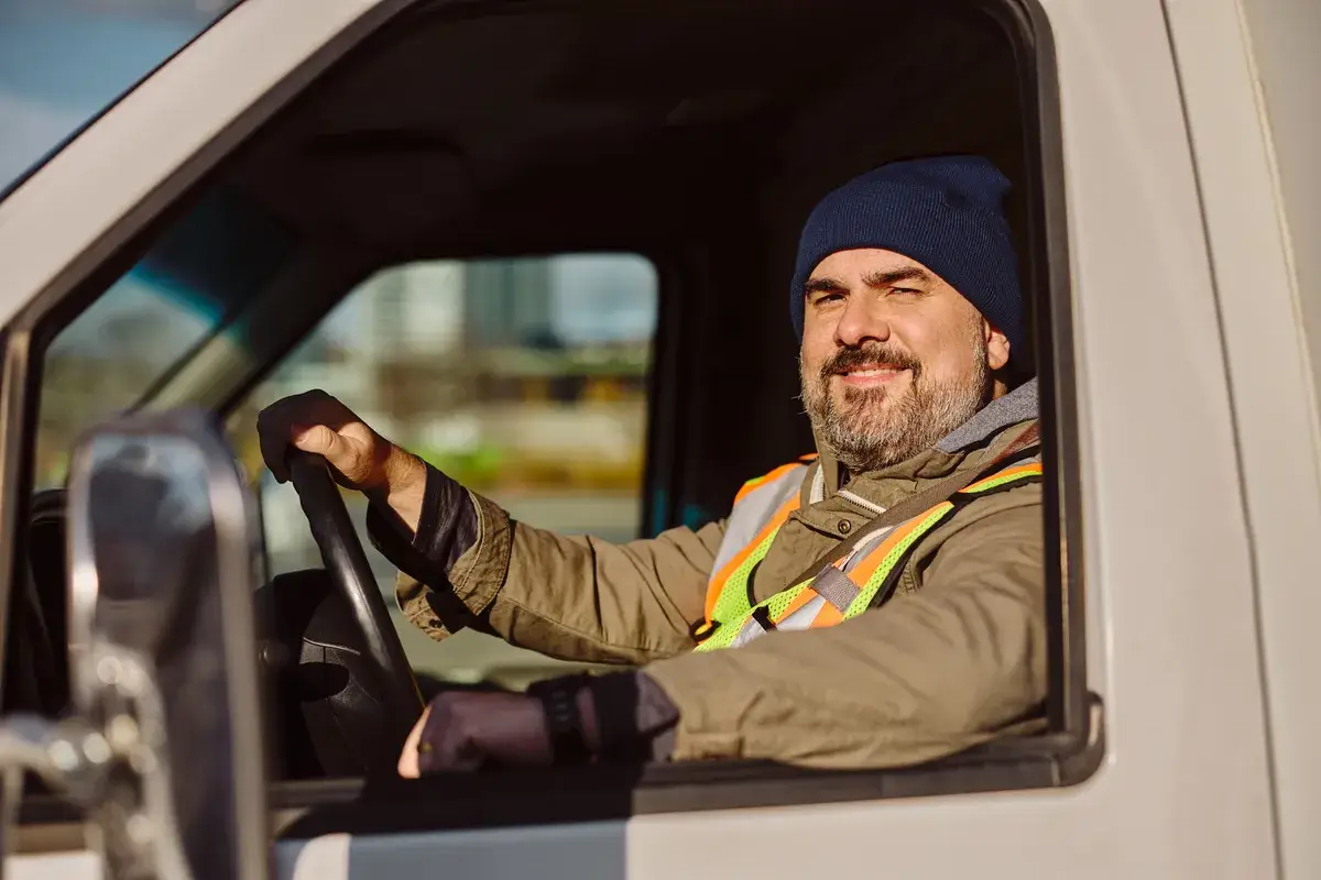 smiling-professional-truck-driver-driving