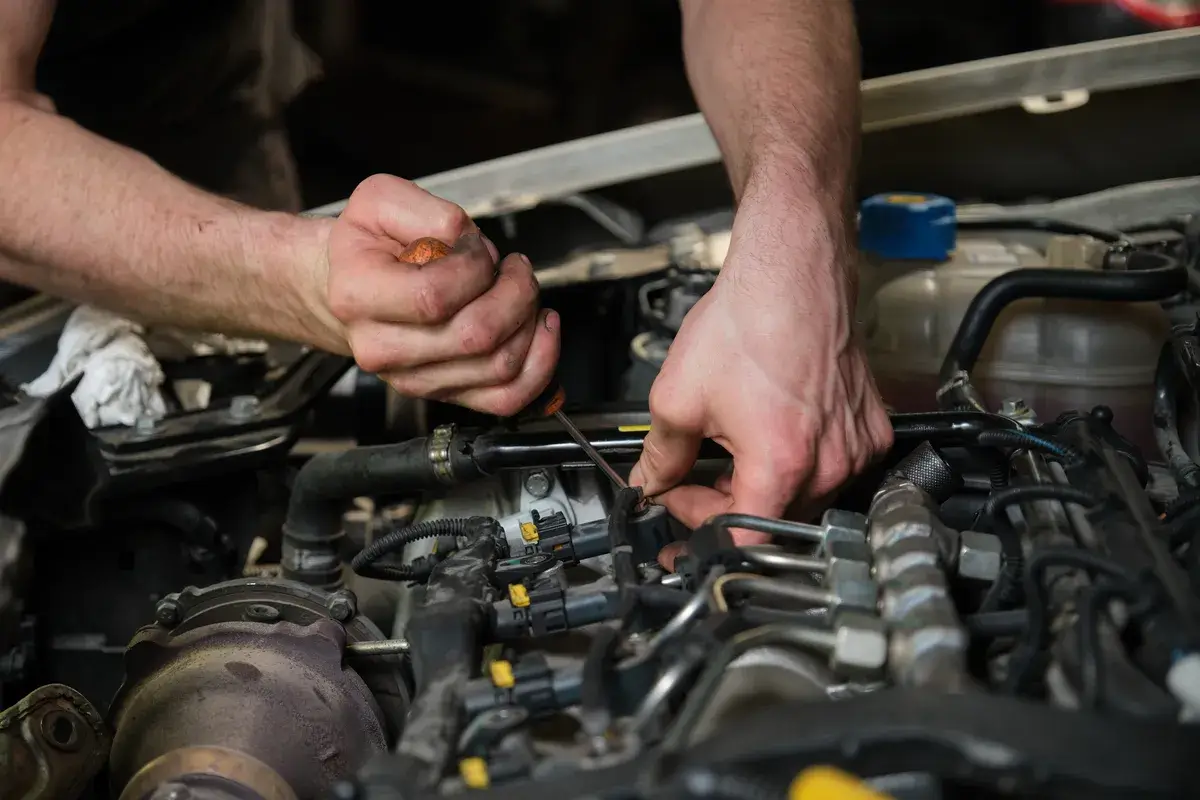 technician-removing-fuel-injectors.webp