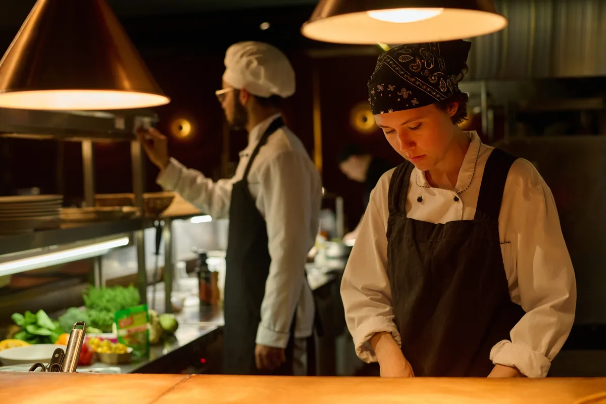 young-serious-female-worker-of-restaurant
