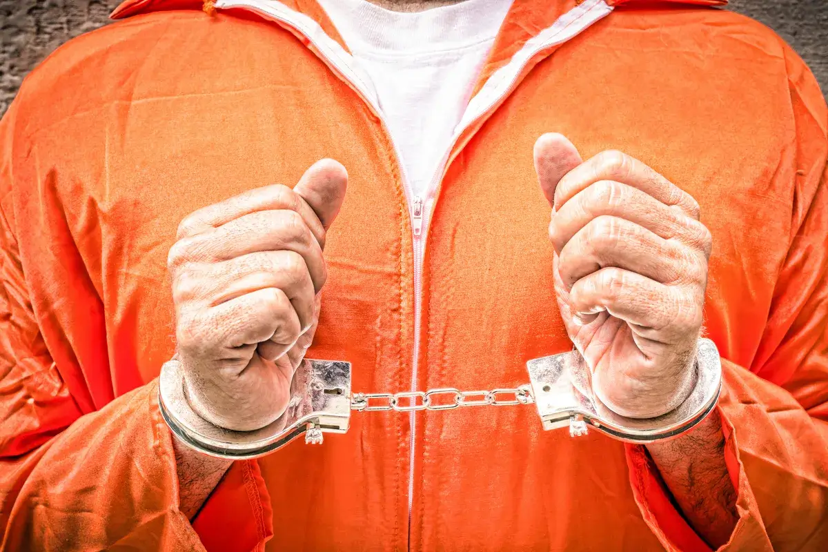 prisoner-with-handcuffed-hands