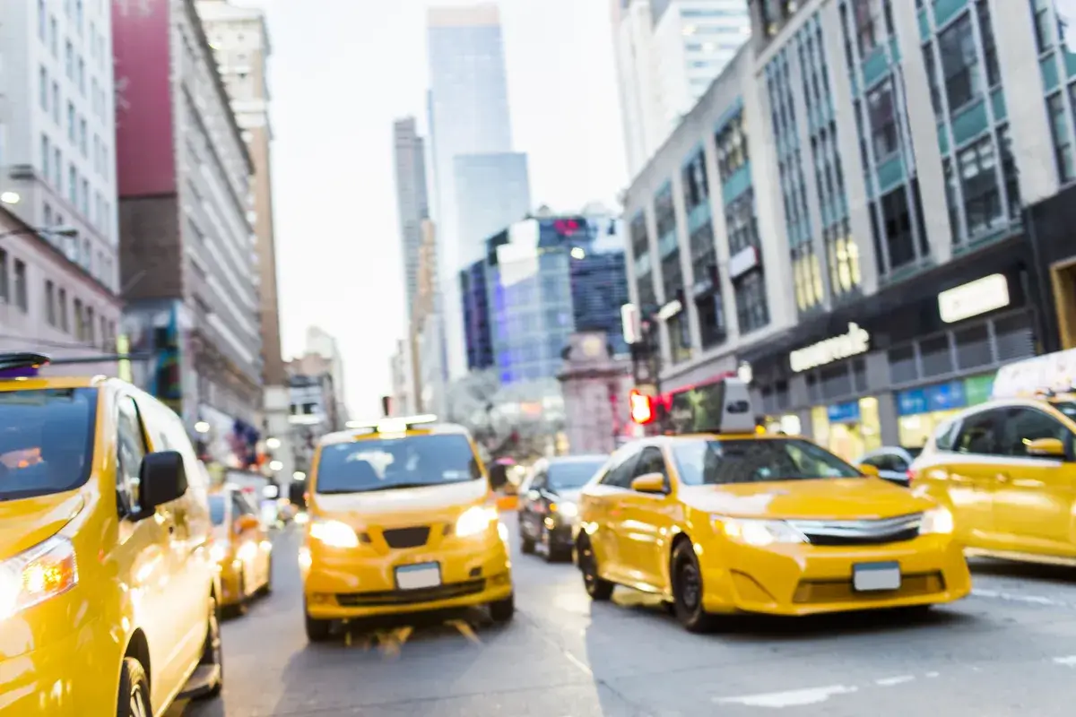 cars-moving-on-road-amidst-modern