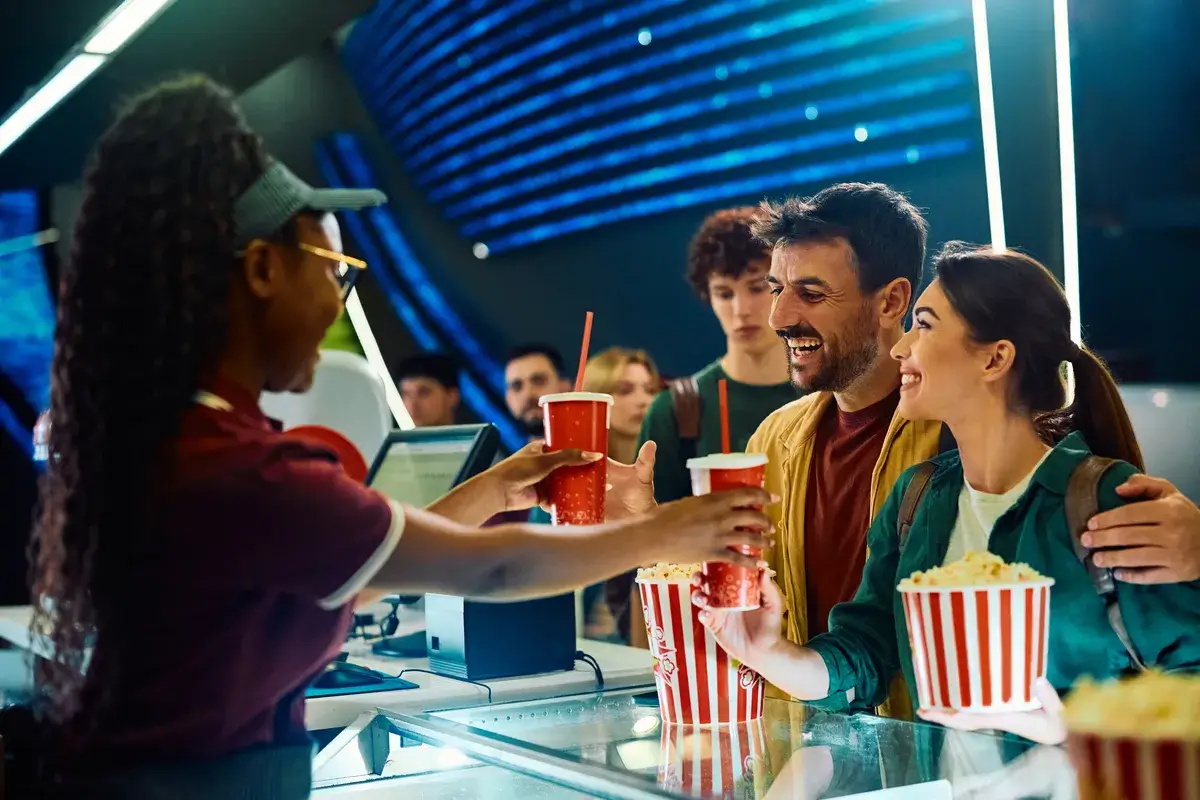 happy-couple-buying-drink-and-snack-