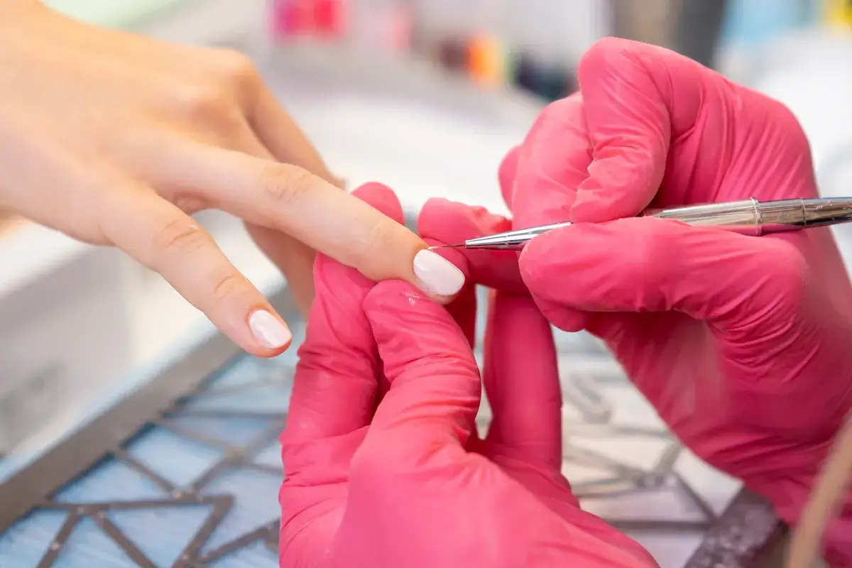 the-manicurist-uses-a-small-brush