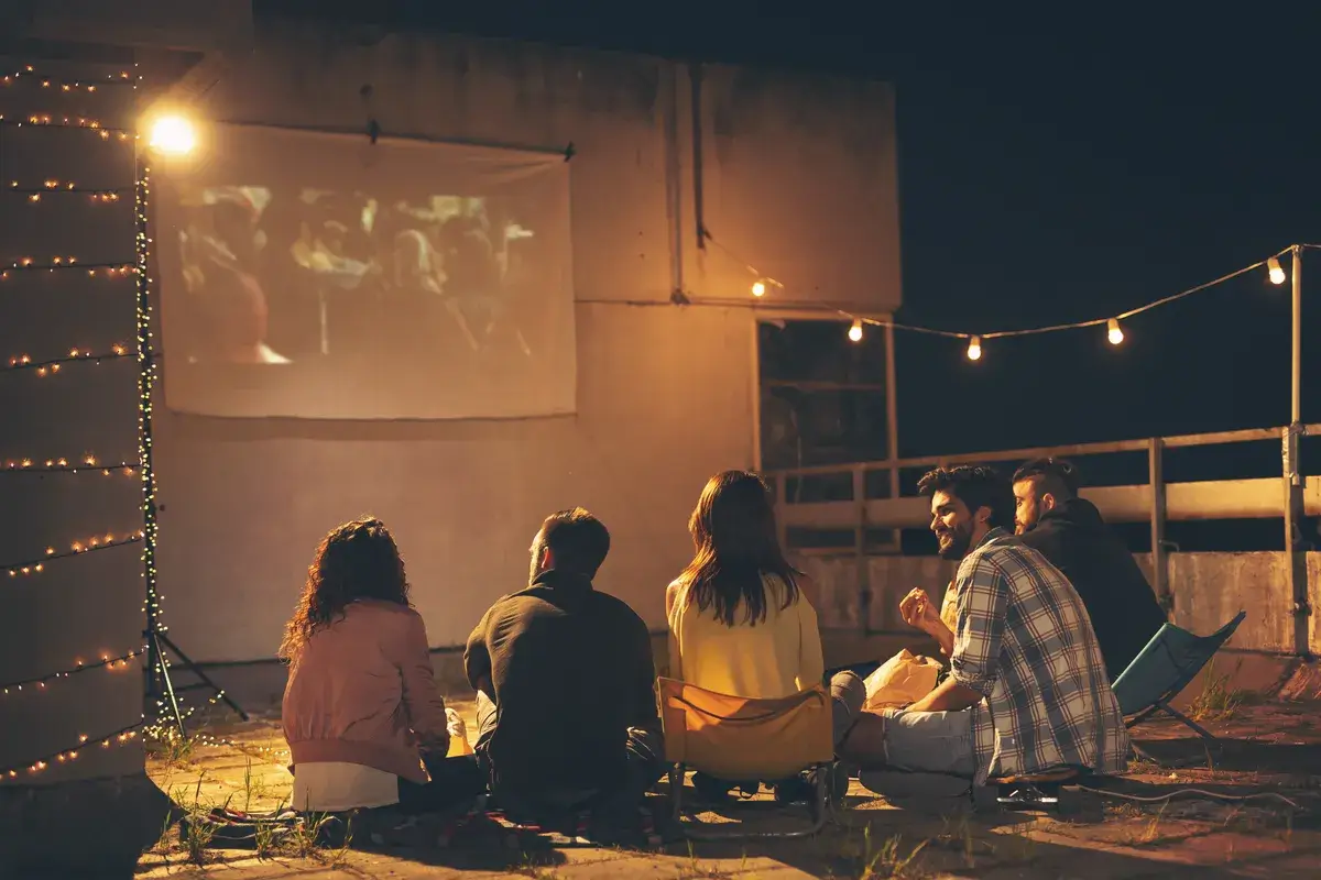 friends-watching-a-movie-on-a-building