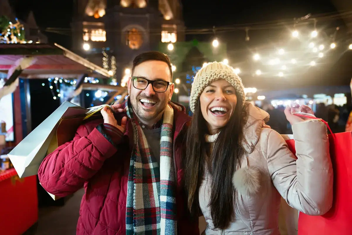 cheerful-happy-couple-doing-christmas