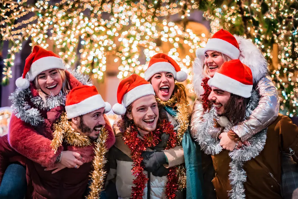 happy-group-of-friends-wearing-santa-claus