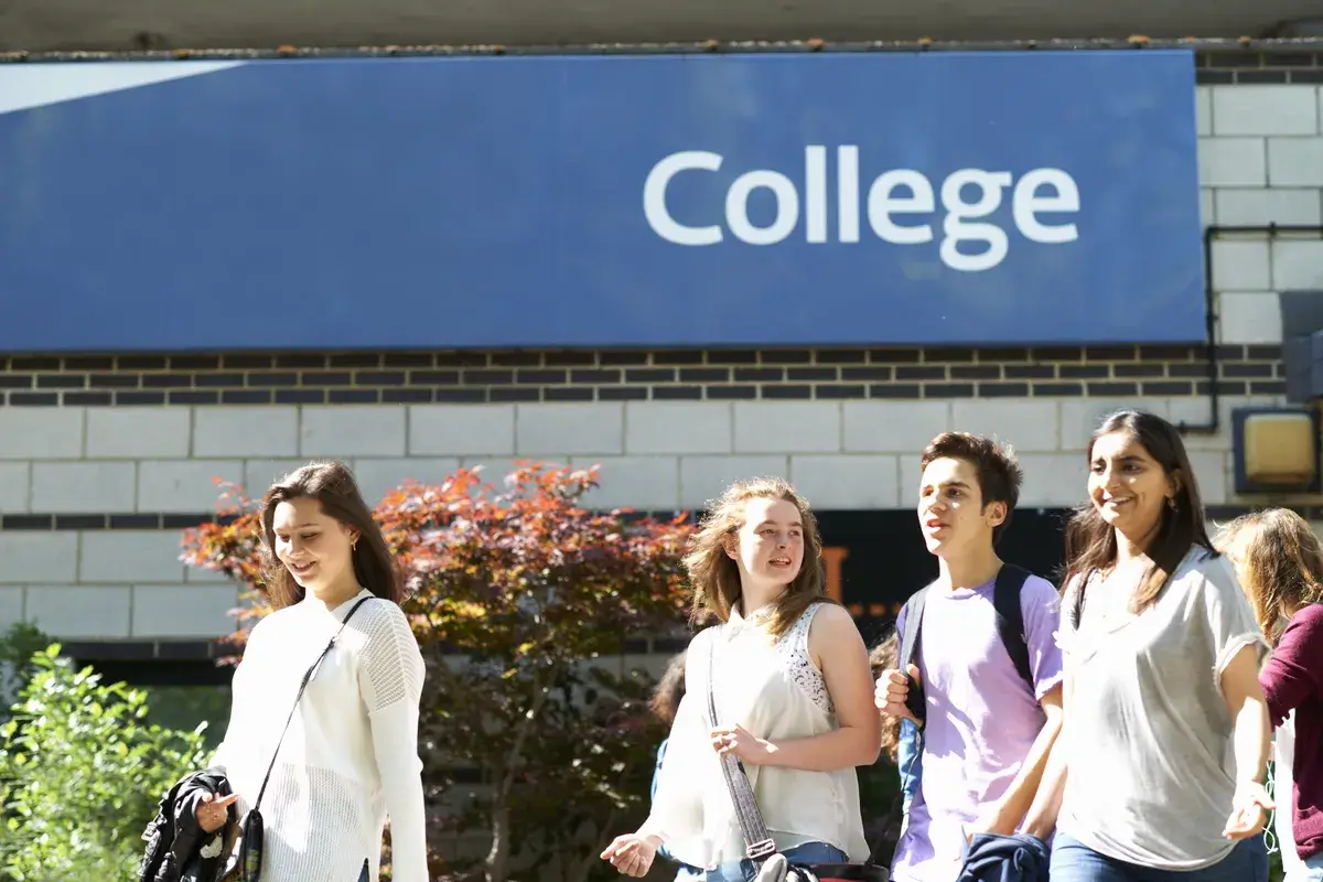 male-and-female-students-strolling-on-college