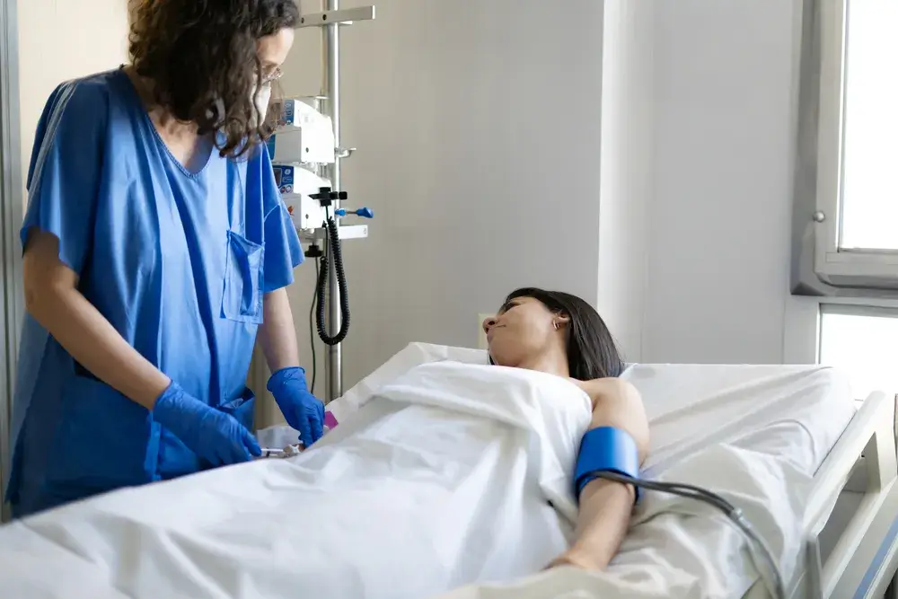 nurse-injecting-saline-solution-to-hospitalized
