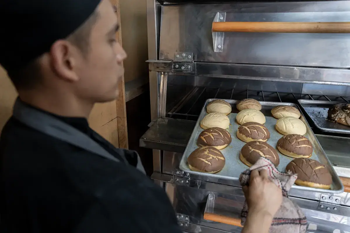 a-young-hispanic-baker-pulling