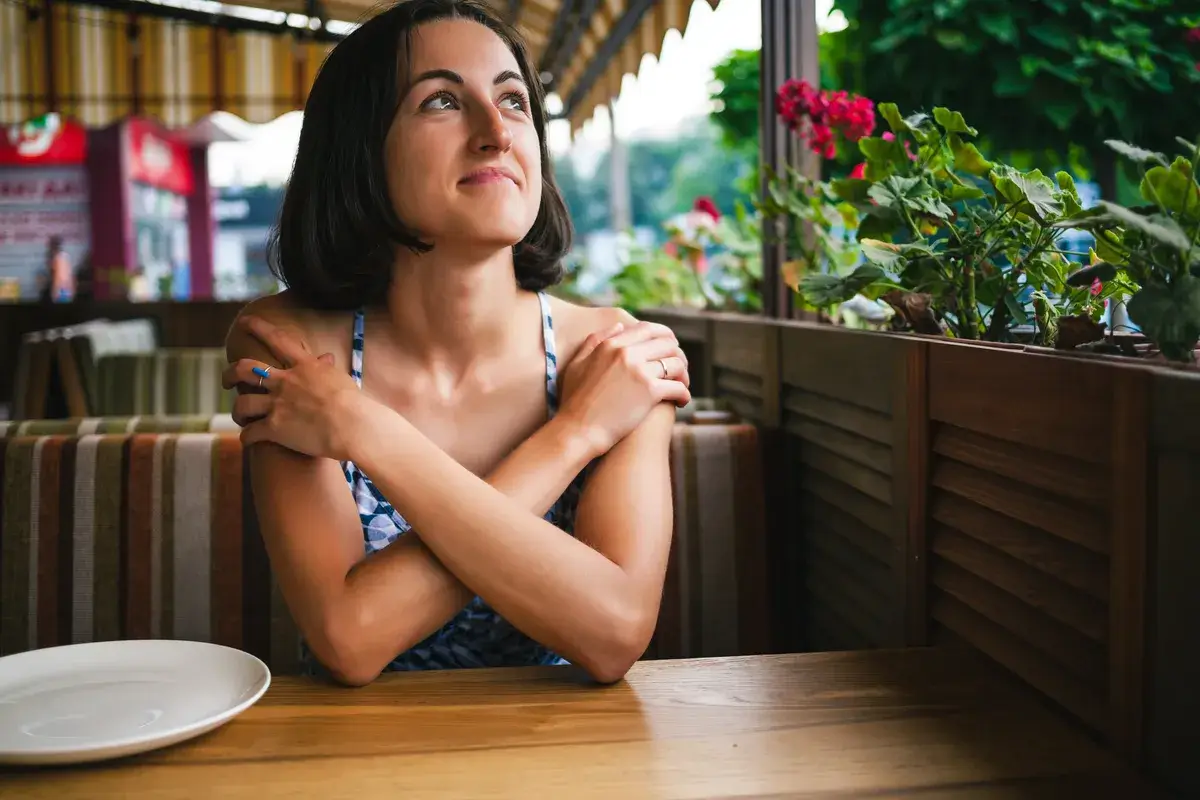 a-girl-is-waiting-for-her-order-in-a-cafe-a-woman