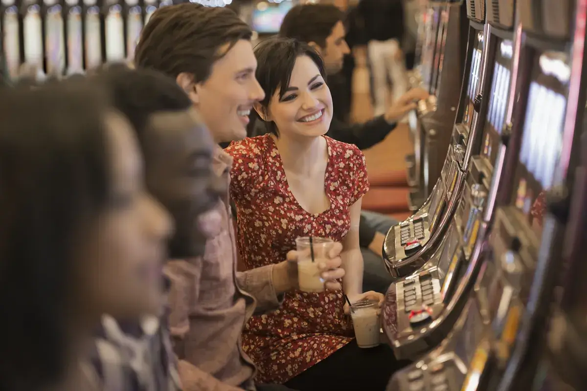 a-group-of-people-playing-the-slot-machines