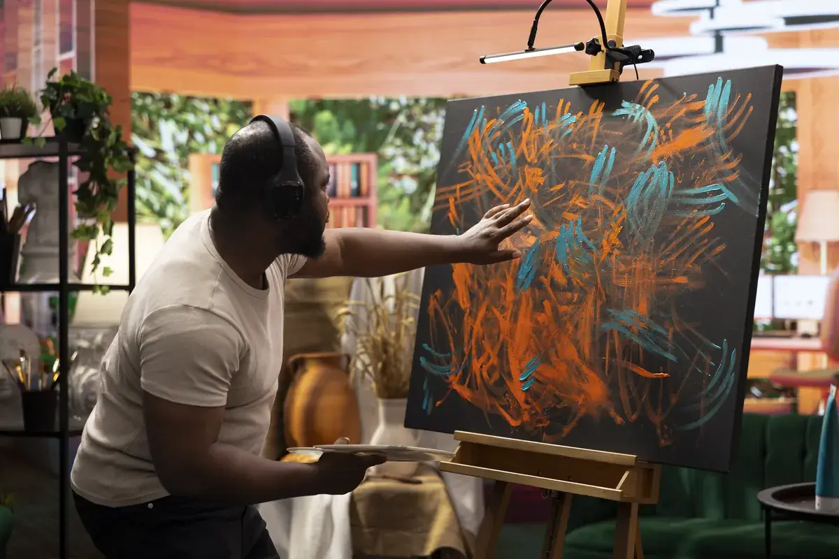 artist-listening-to-music-and-creating