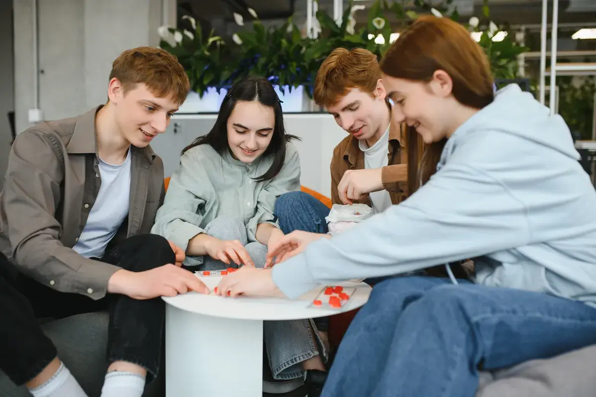 group-of-young-adults-playing-board-game