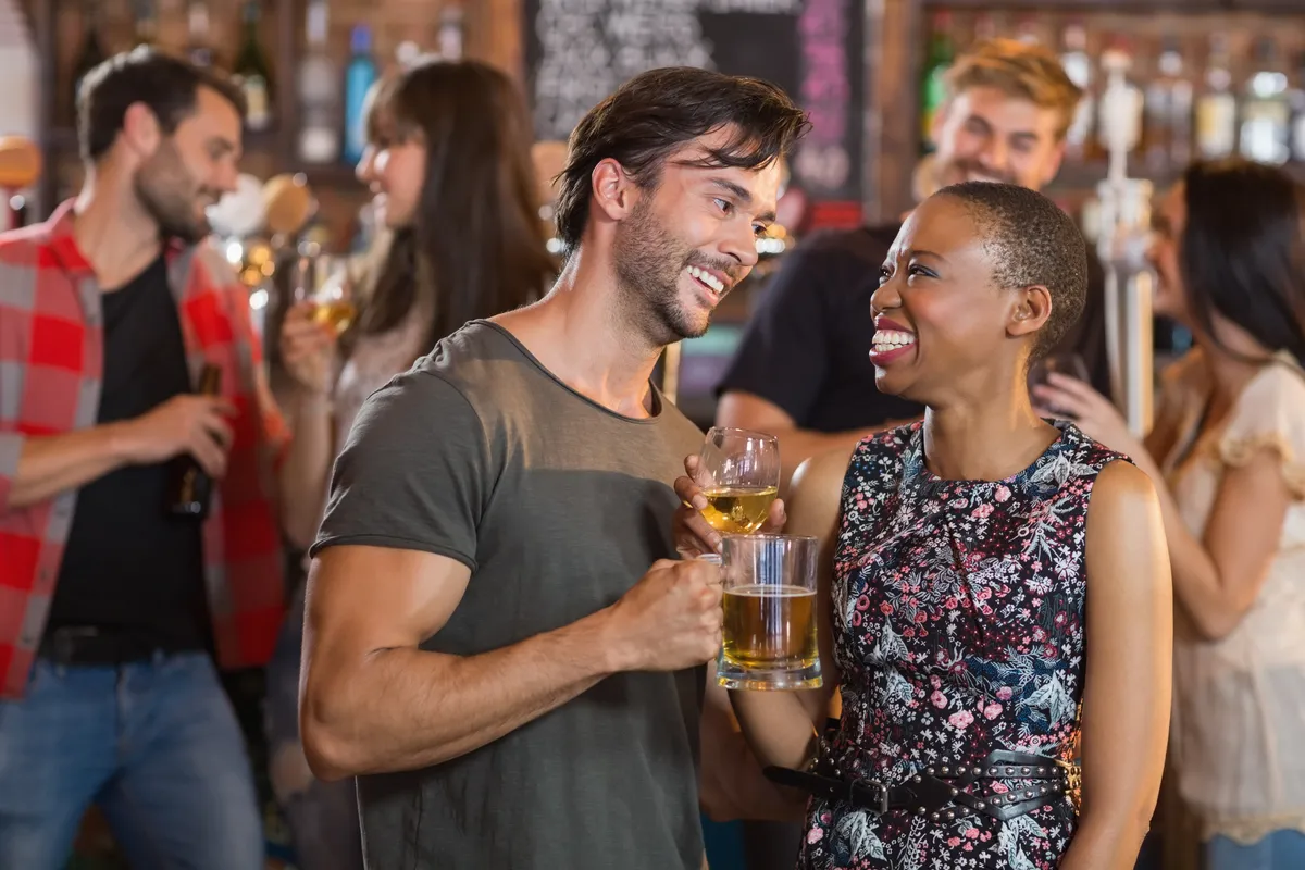 happy-young-couple-holding-beer