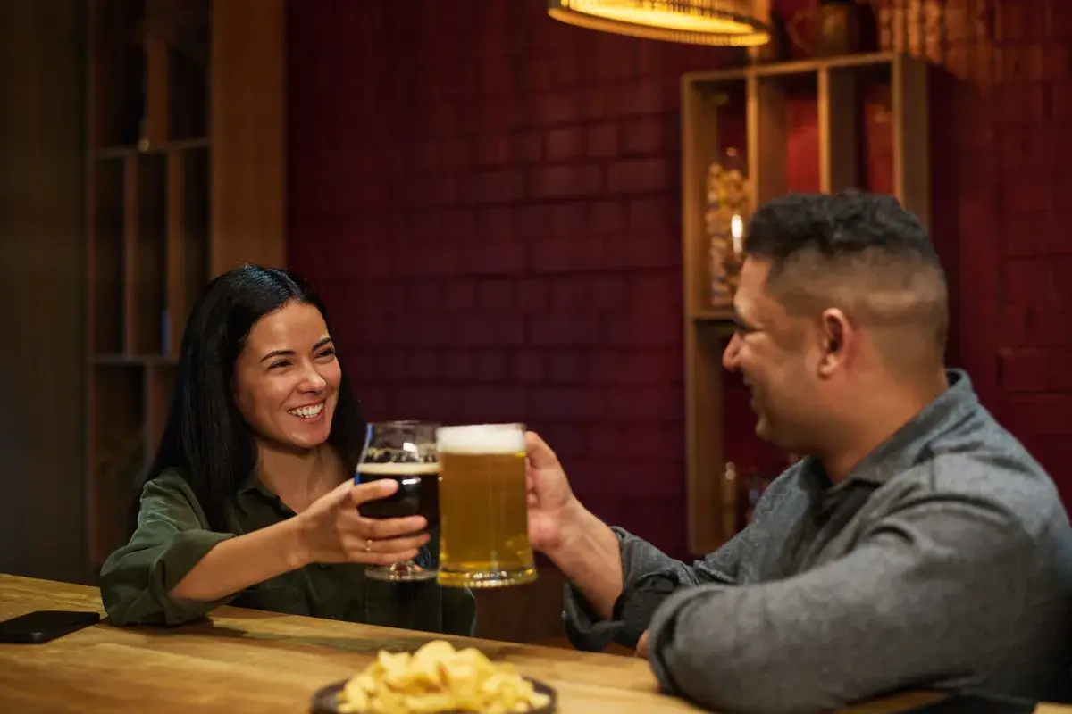 young-cheerful-brunette-woman-clinking