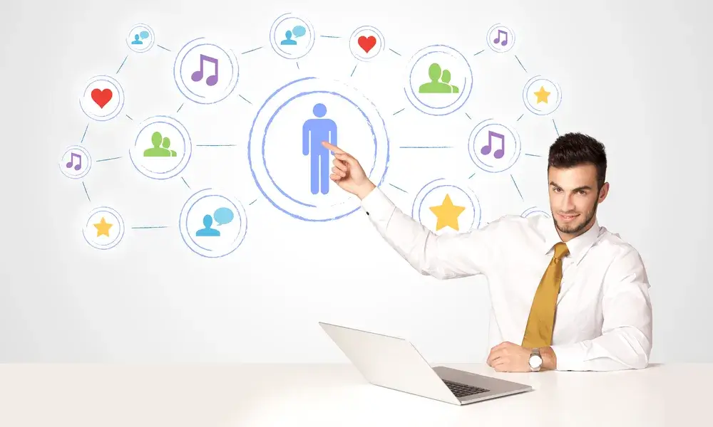 businessman-sitting-at-white-table-with