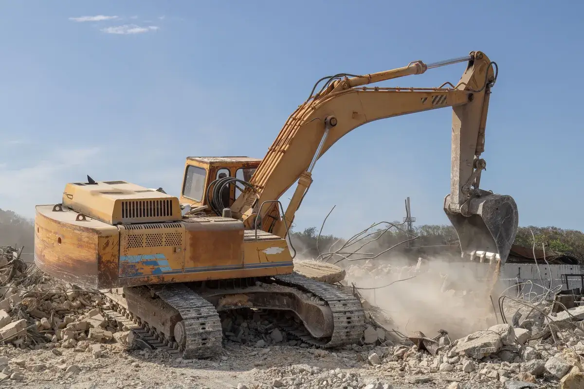 excavator-loading-rubble-into-a-dump