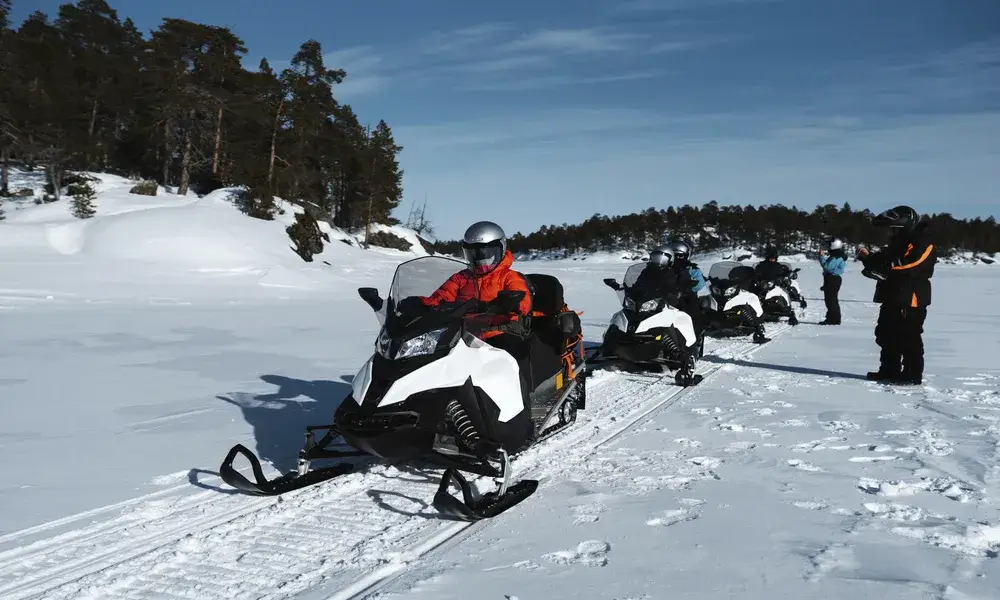 people-on-snowmobiles-2026