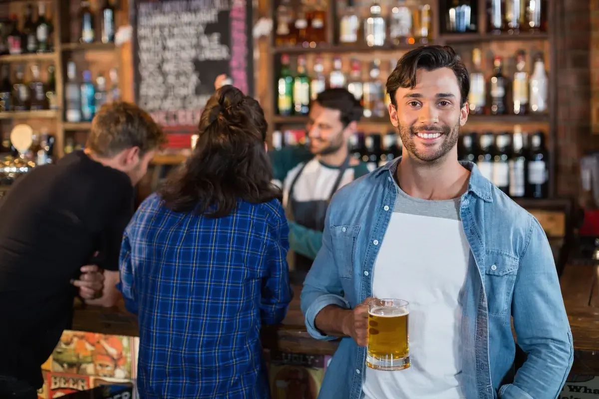 portrait-of-smiling-man-holding-beer