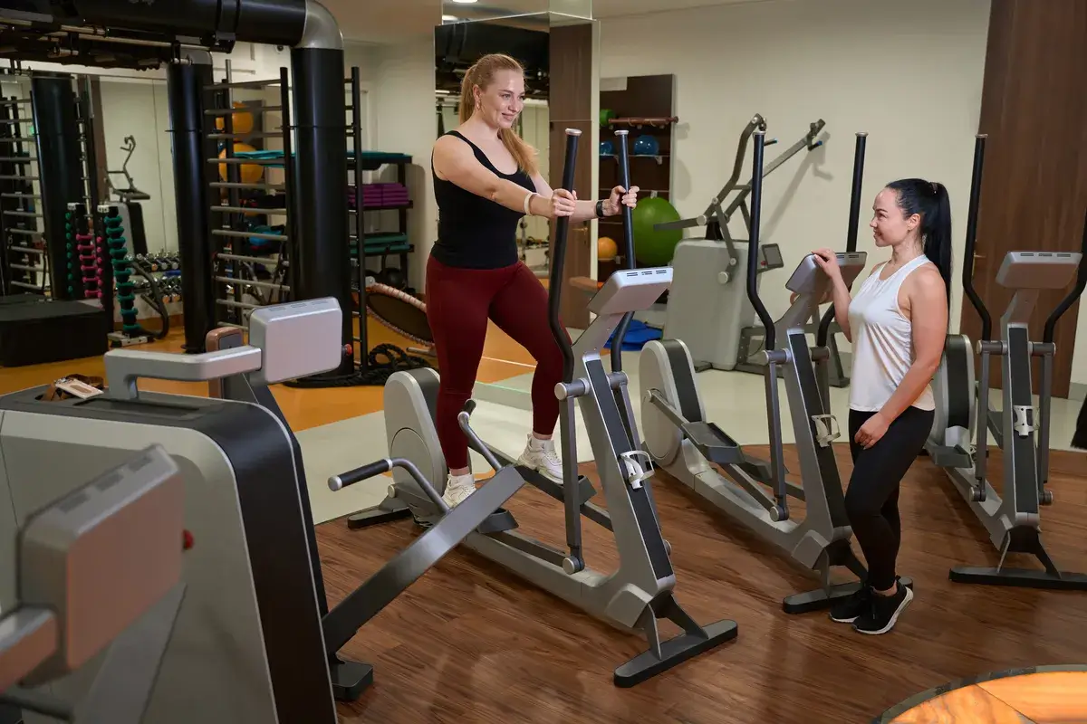 two-women-are-in-the-gym-of-a-fitness