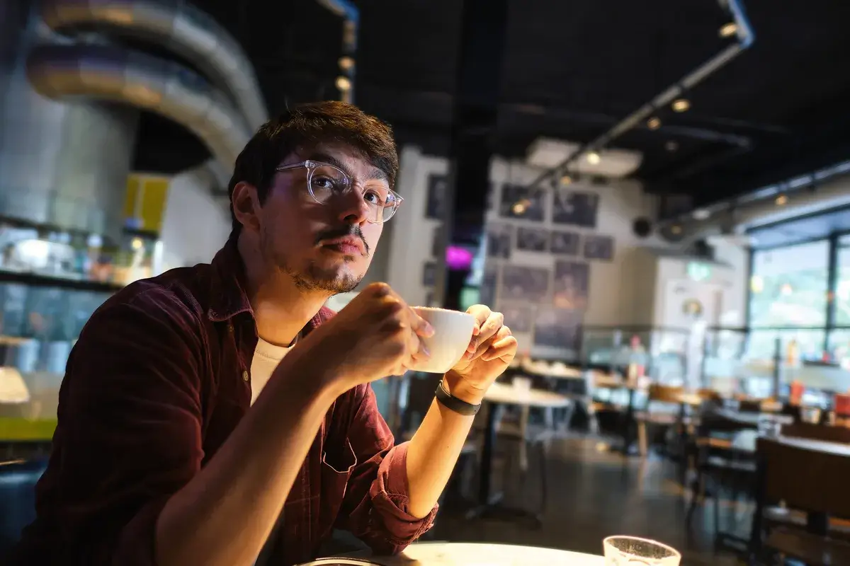 a-young-man-enjoying-his-coffee-in-a-cafe