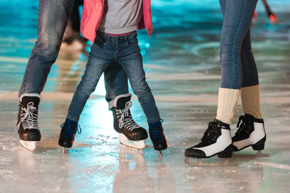 cropped-shot-of-young-family-in-skates