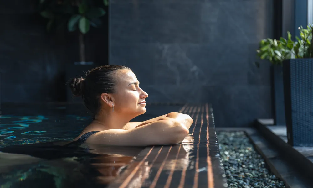 woman-relaxing-in-spa-pool-by-the-window