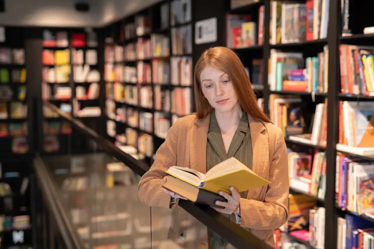 young-serious-female-with-open-book