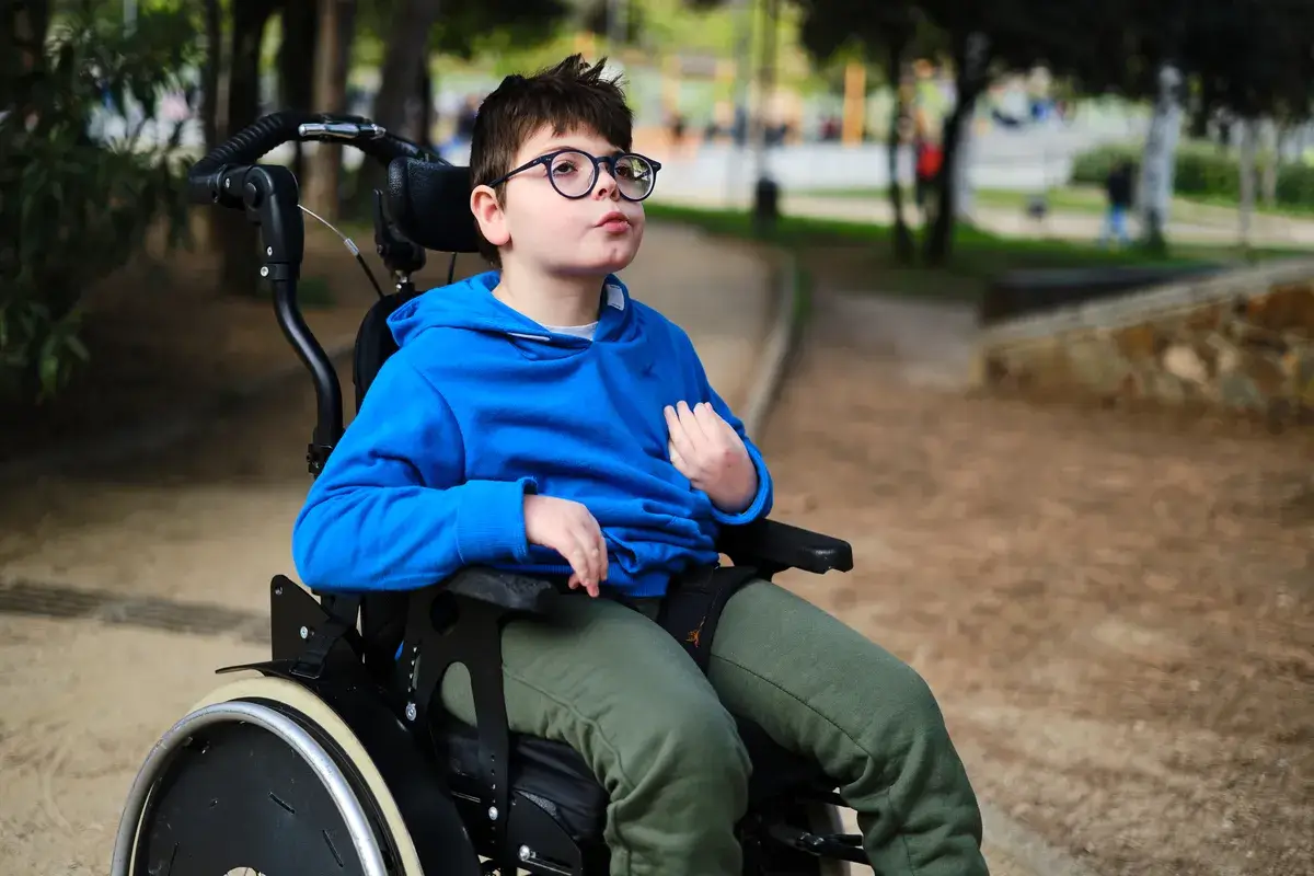 disabled-boy-in-wheelchair-enjoying
