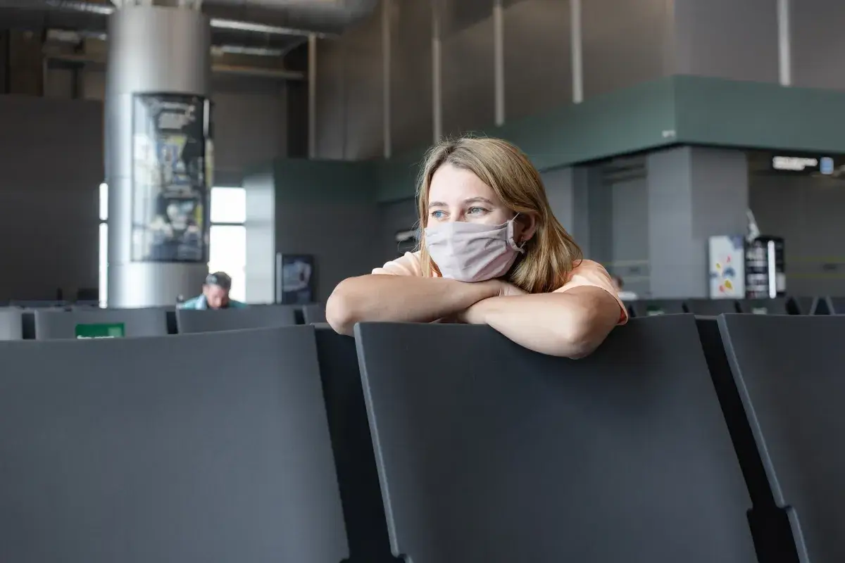 girl-in-protective-mask-at-airport