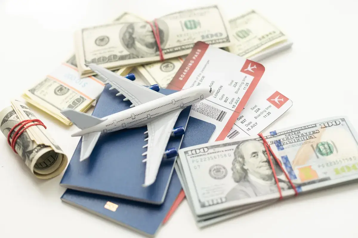 white-plane-on-dollar-cash-closeup