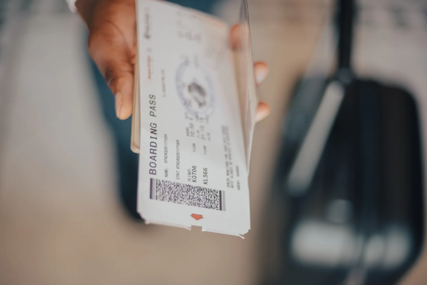 a-man-holding-a-passport-and-boarding