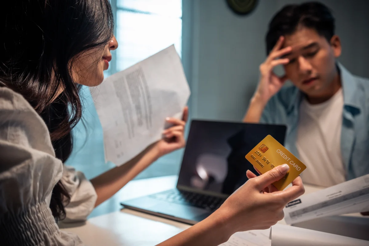 couple-discussing-finances-at-table-with