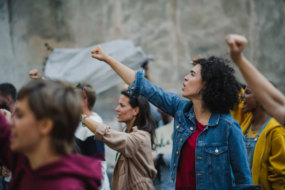 determined-crowd-raising-fists-in-urban-protest