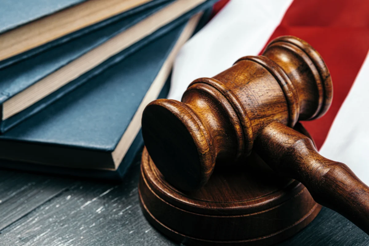 gavel-and-books-on-a-flag