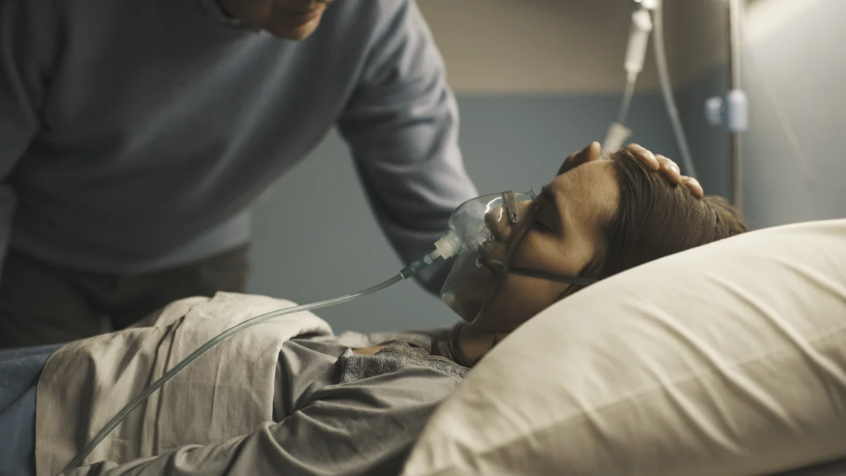 caring-father-assisting-her-daughter-at-the-hospit